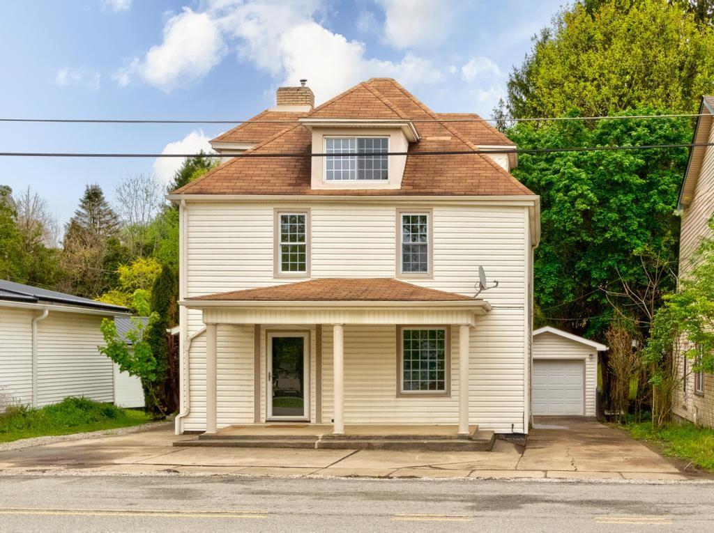 1660 Mercer Road Ellwood City, PA 16117 - Photo 2 of 41 a front view of a house
