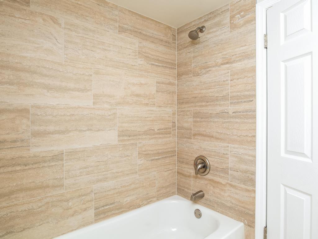 1660 Mercer Road Ellwood City, PA 16117 - Photo 30 of 41 a bathroom with a bathtub