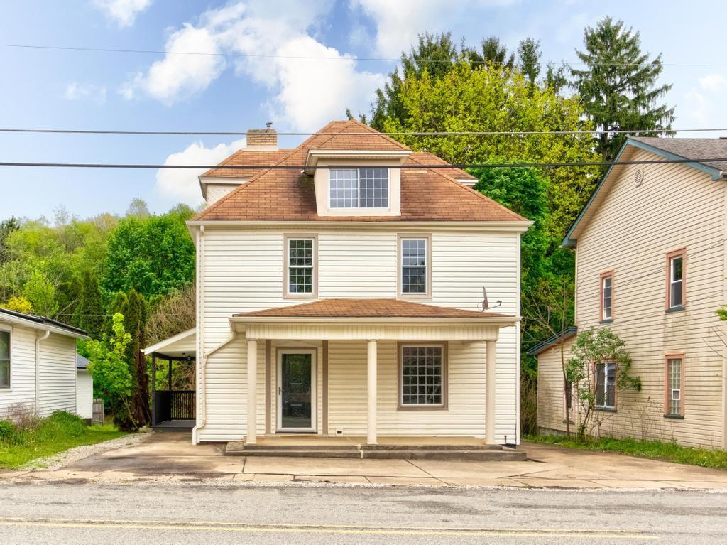 1660 Mercer Road Ellwood City, PA 16117 - Photo 3 of 41 a front view of a house