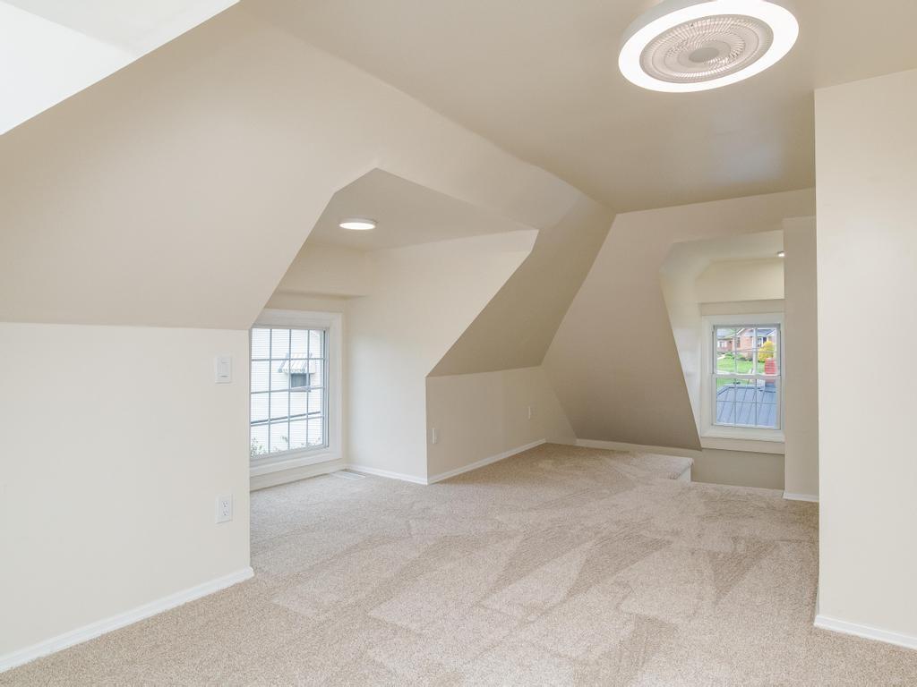 1660 Mercer Road Ellwood City, PA 16117 - Photo 31 of 41 an empty room with windows and closet