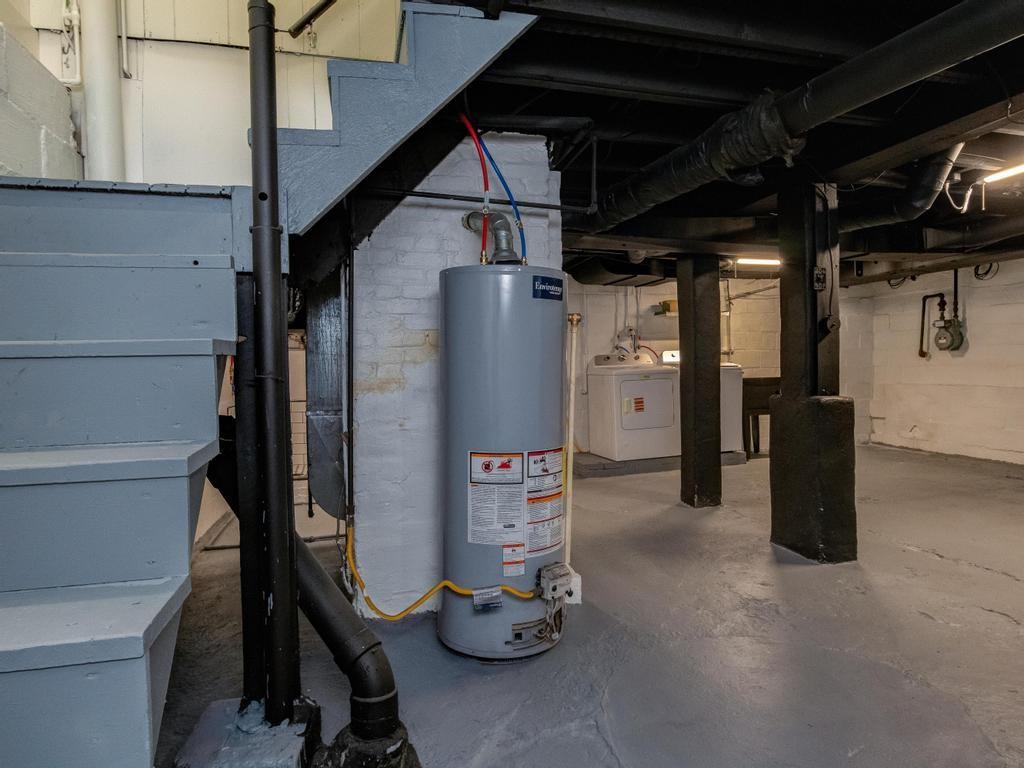 1660 Mercer Road Ellwood City, PA 16117 - Photo 34 of 41 a view of a storage room with water heater and stairs