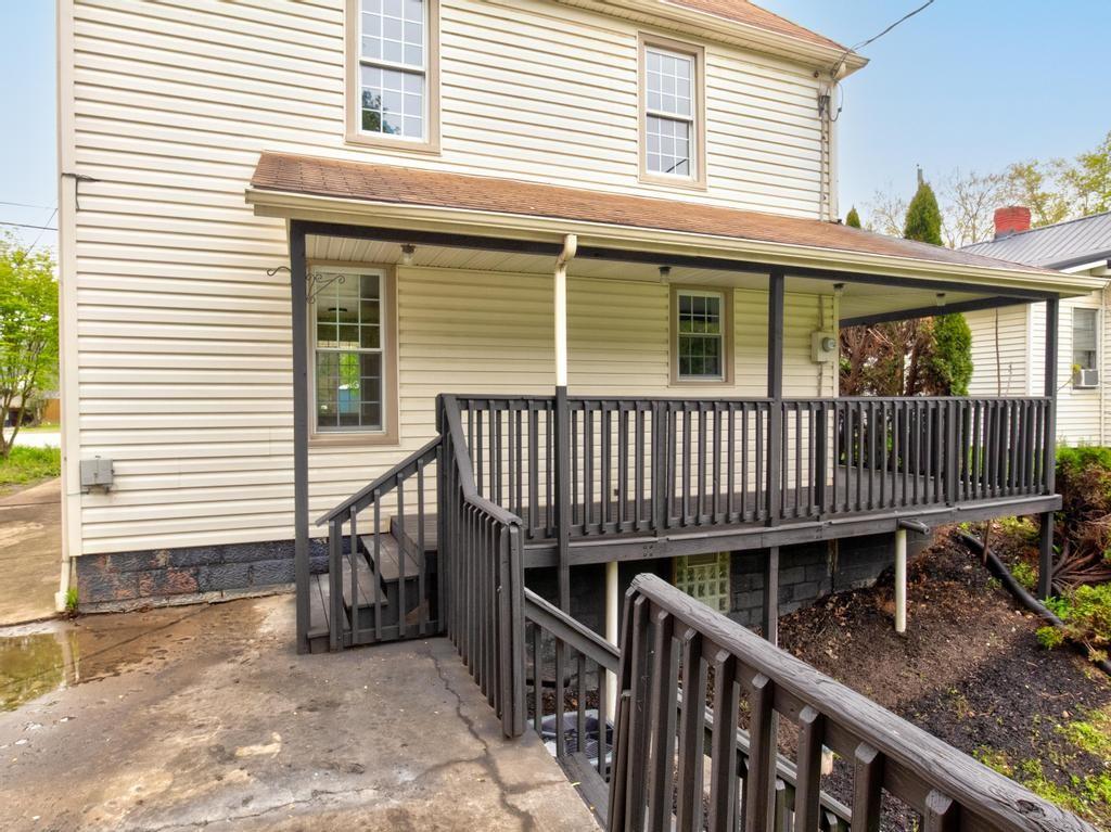 1660 Mercer Road Ellwood City, PA 16117 - Photo 38 of 41 a view of a house with a deck and furniture