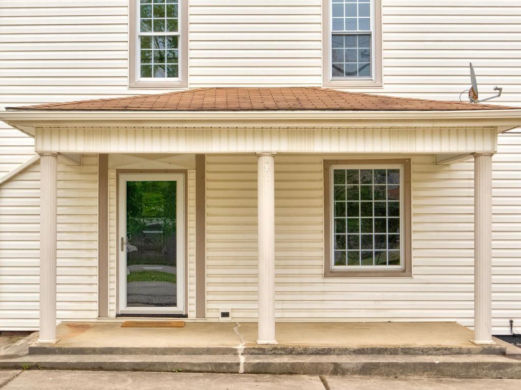 1660 Mercer Road Ellwood City, PA 16117 - Photo 5 of 41 front view of a house