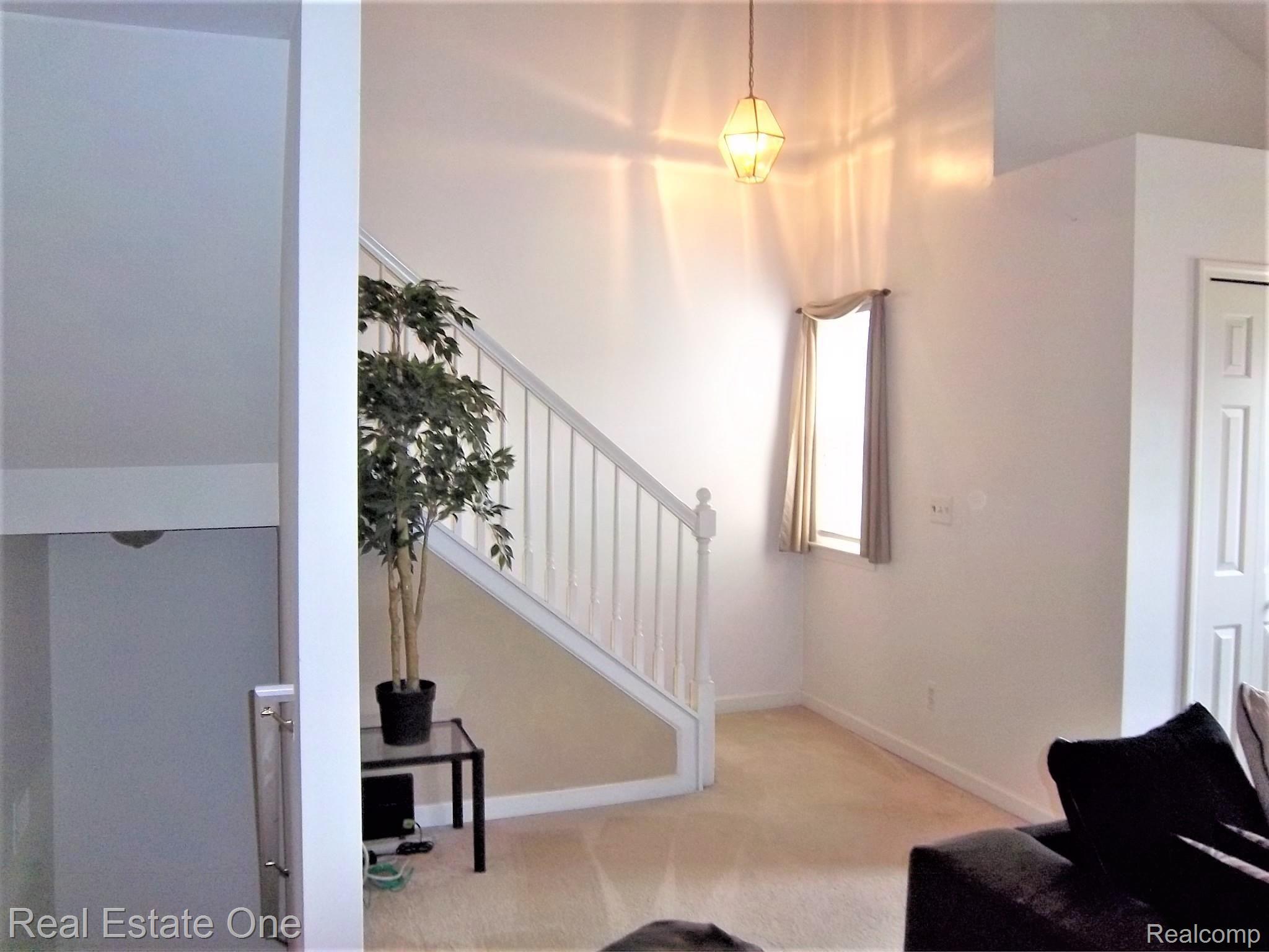 16802 Farmington Road Livonia, MI 48154 - Photo 15 of 23 LANDING AND STAIR WAY UPSTAIRS.