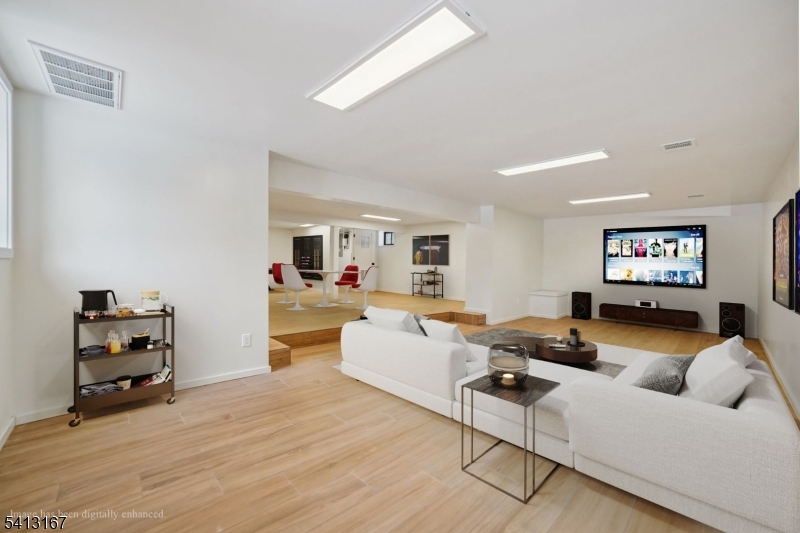 156 Park Road Parsippany, NJ 07054 - Photo 40 of 44 a living room with furniture and a flat screen tv