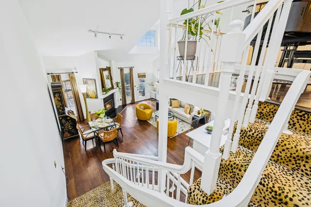 a living room with furniture and a rug