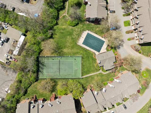 an aerial view of a house with a swimming pool