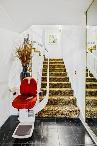 a living room with furniture potted plant and a window
