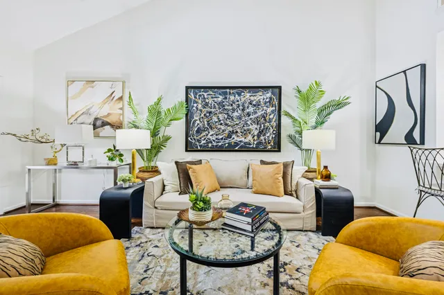 a living room with furniture and a table