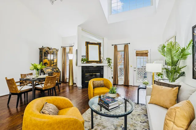 a living room with furniture and a rug