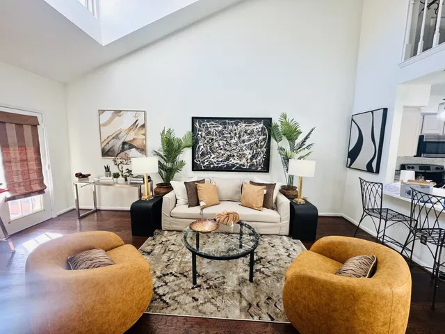 a couple of chairs sitting in front of a balcony