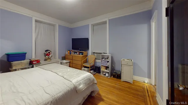 a bedroom with bed and a window