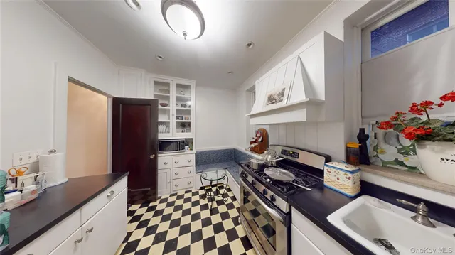 a kitchen with a refrigerator and a stove