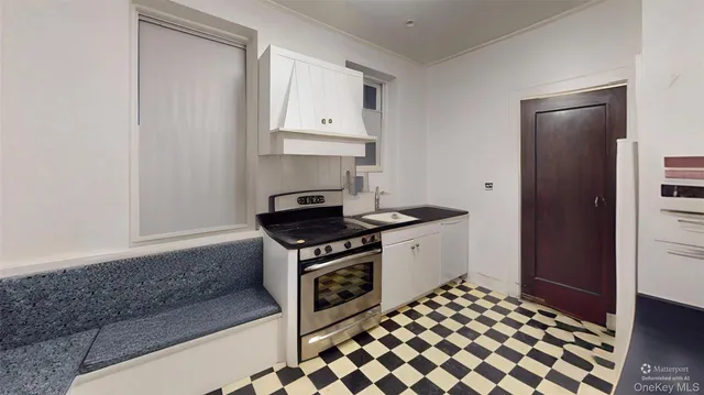 a kitchen with a stove and a refrigerator