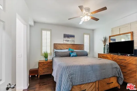 a bedroom with bed and window