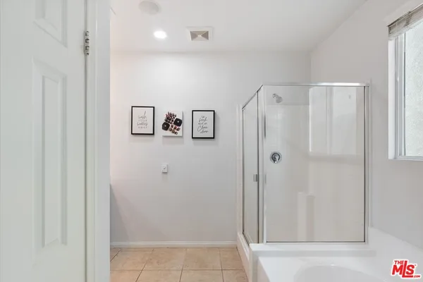 a bathroom with a sink double vanity and a mirror