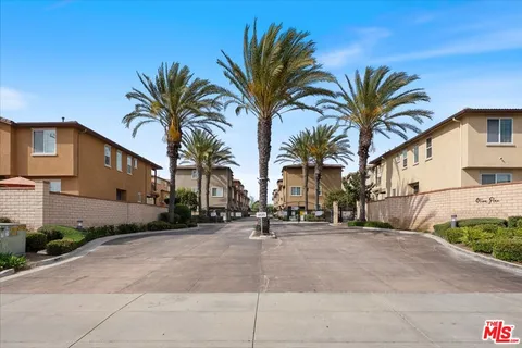 a view of grassy field with mountain
