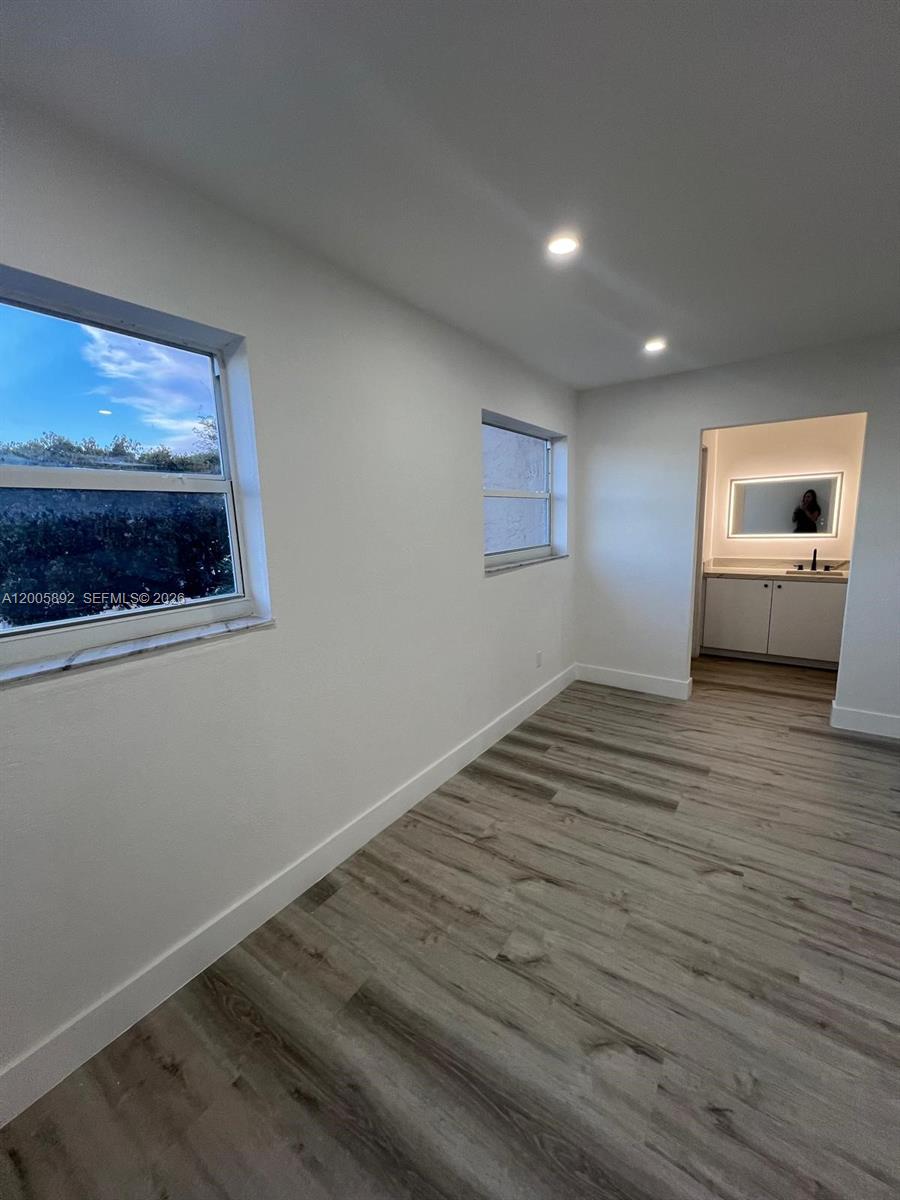 3632 Southwest 112th Avenue, Unit 63 Miami, FL 33165 - Photo 11 of 14 a view of empty room with wooden floor