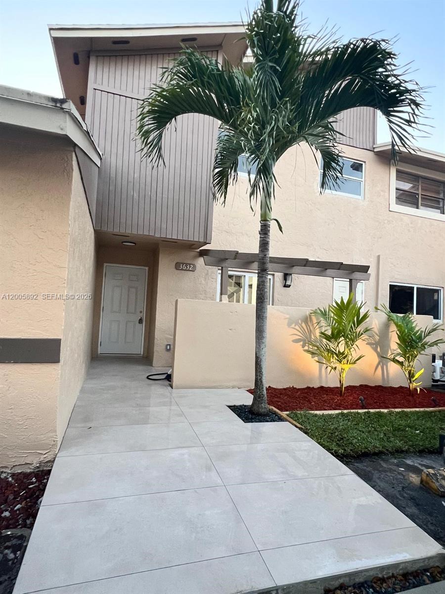 3632 Southwest 112th Avenue, Unit 63 Miami, FL 33165 - Photo 2 of 14 a view of a entrance gate of the house