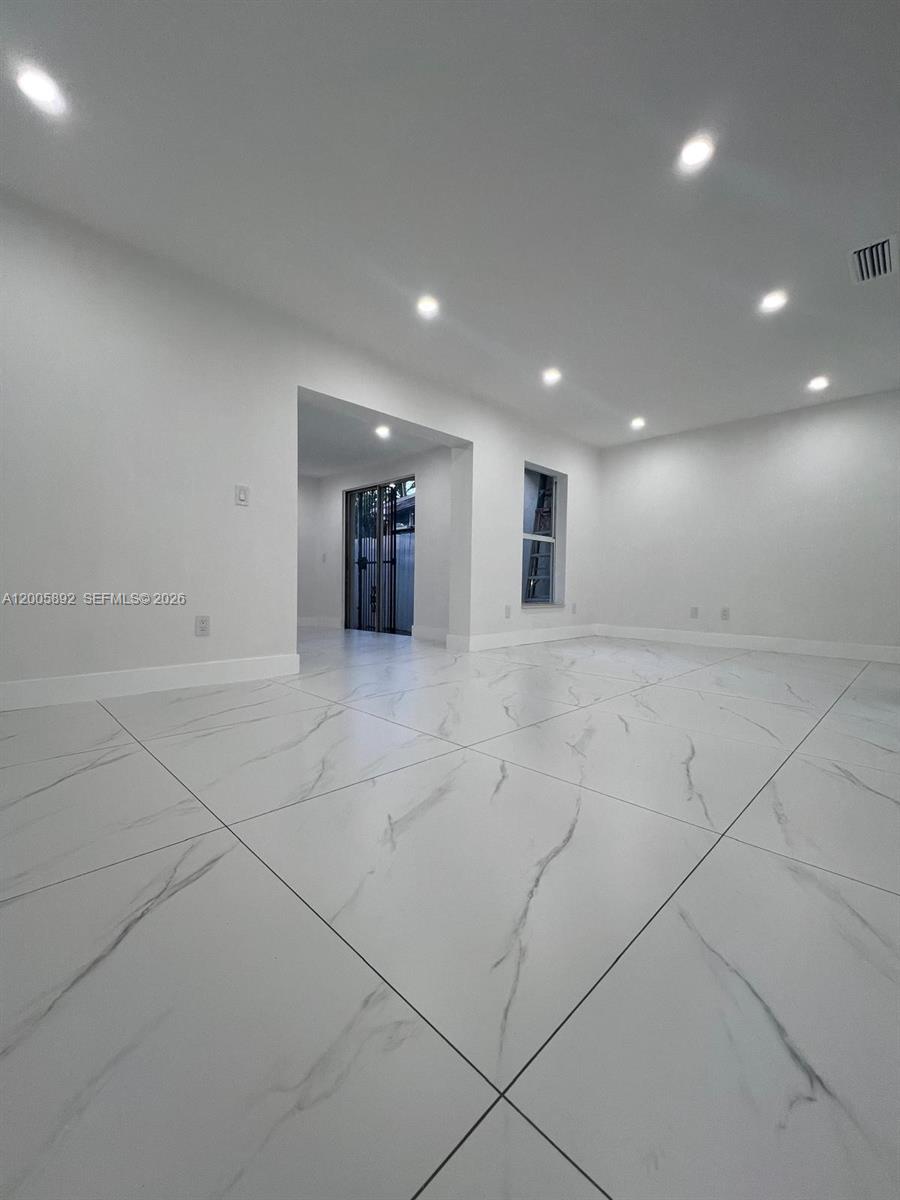 3632 Southwest 112th Avenue, Unit 63 Miami, FL 33165 - Photo 10 of 14 a view of an empty room with wooden floor