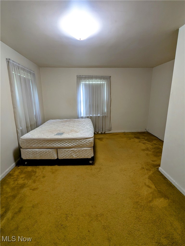 4965 Atchison Road Bellaire, OH 43906 - Photo 16 of 23 Bedroom featuring baseboards and carpet flooring