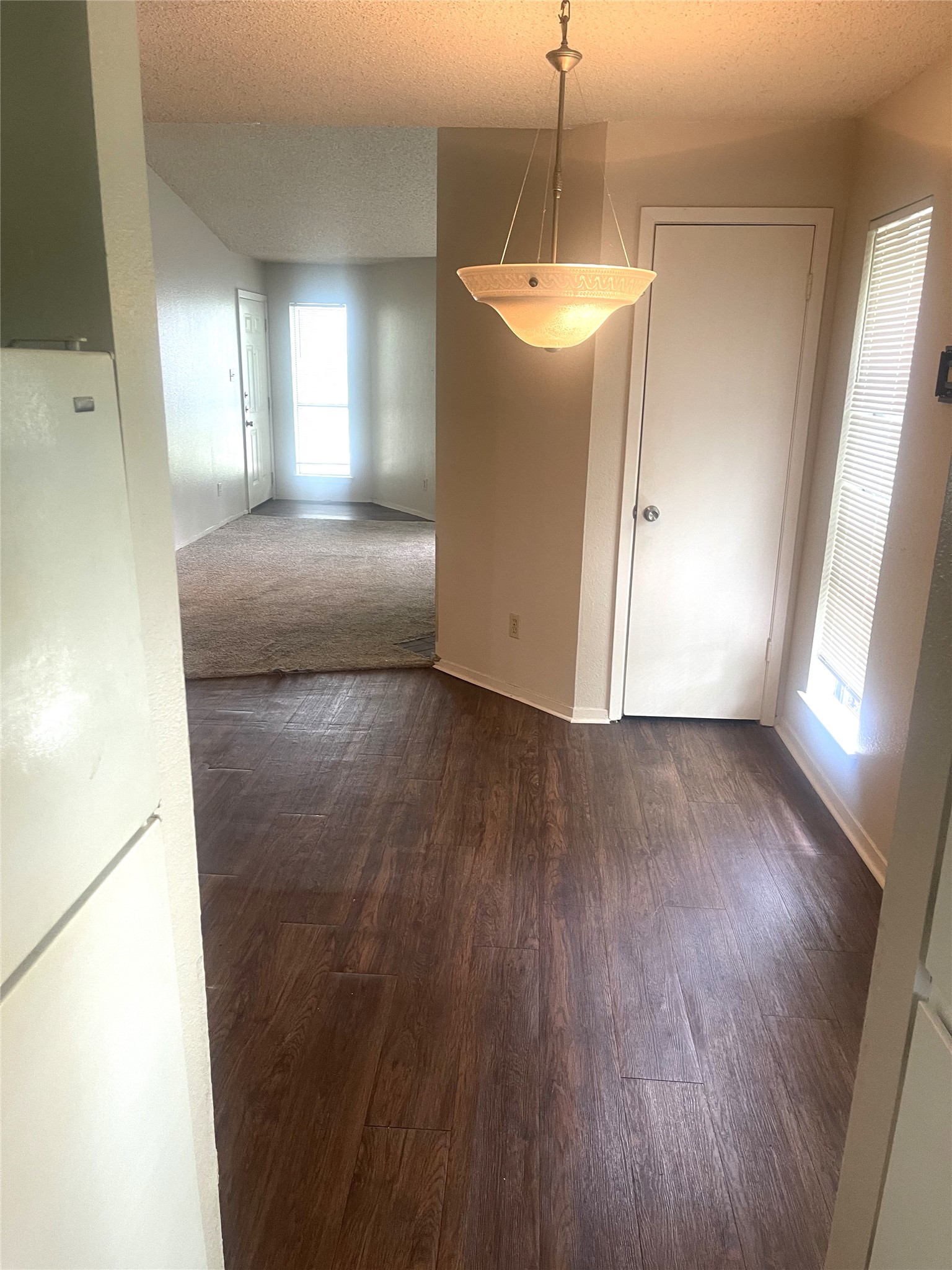 2005 West Loop, Unit D1 Austin, TX 78758 - Photo 18 of 31 a view of a big room with wooden floor and windows