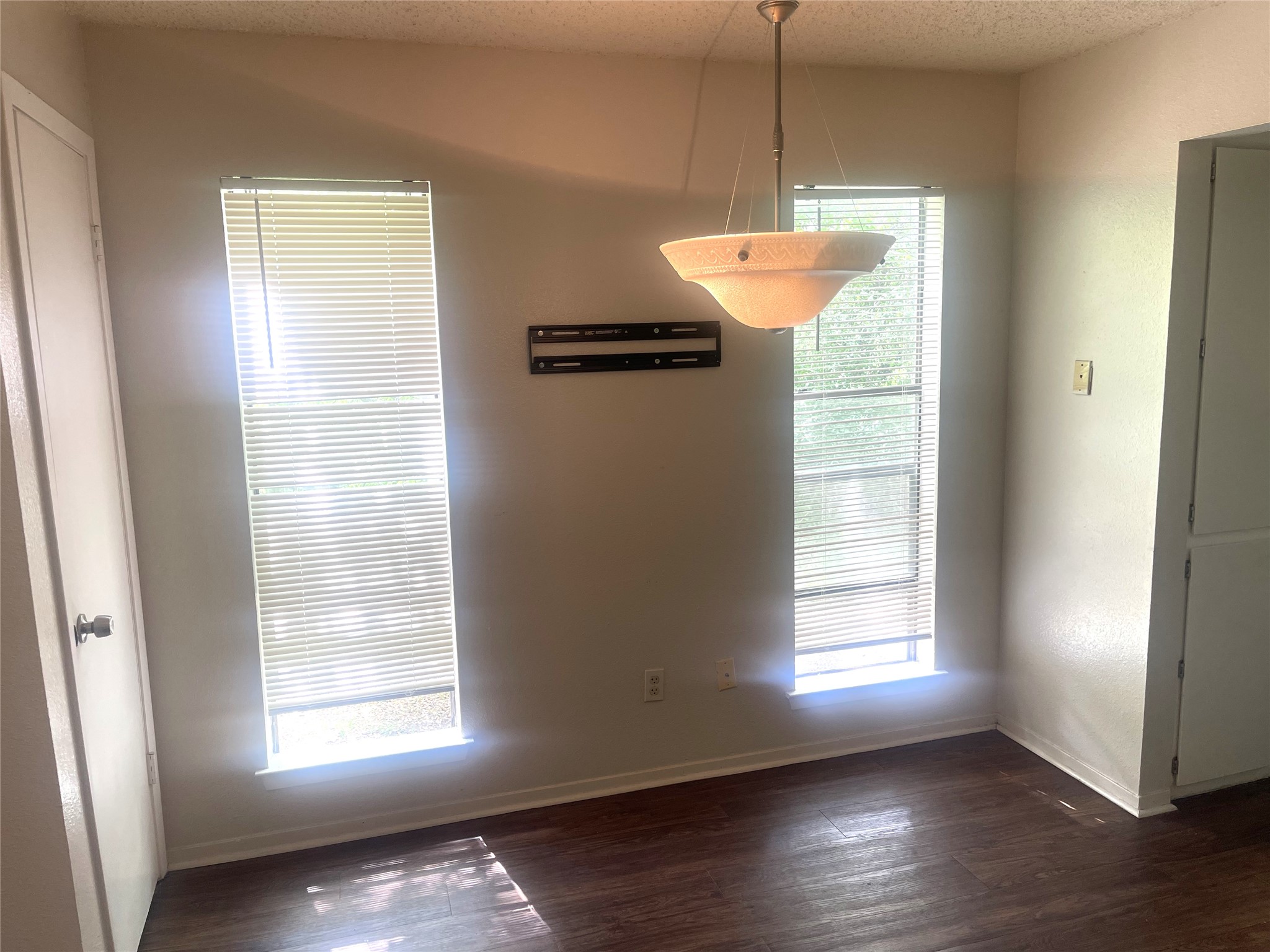 2005 West Loop, Unit D1 Austin, TX 78758 - Photo 24 of 31 a room with window and wooden floor