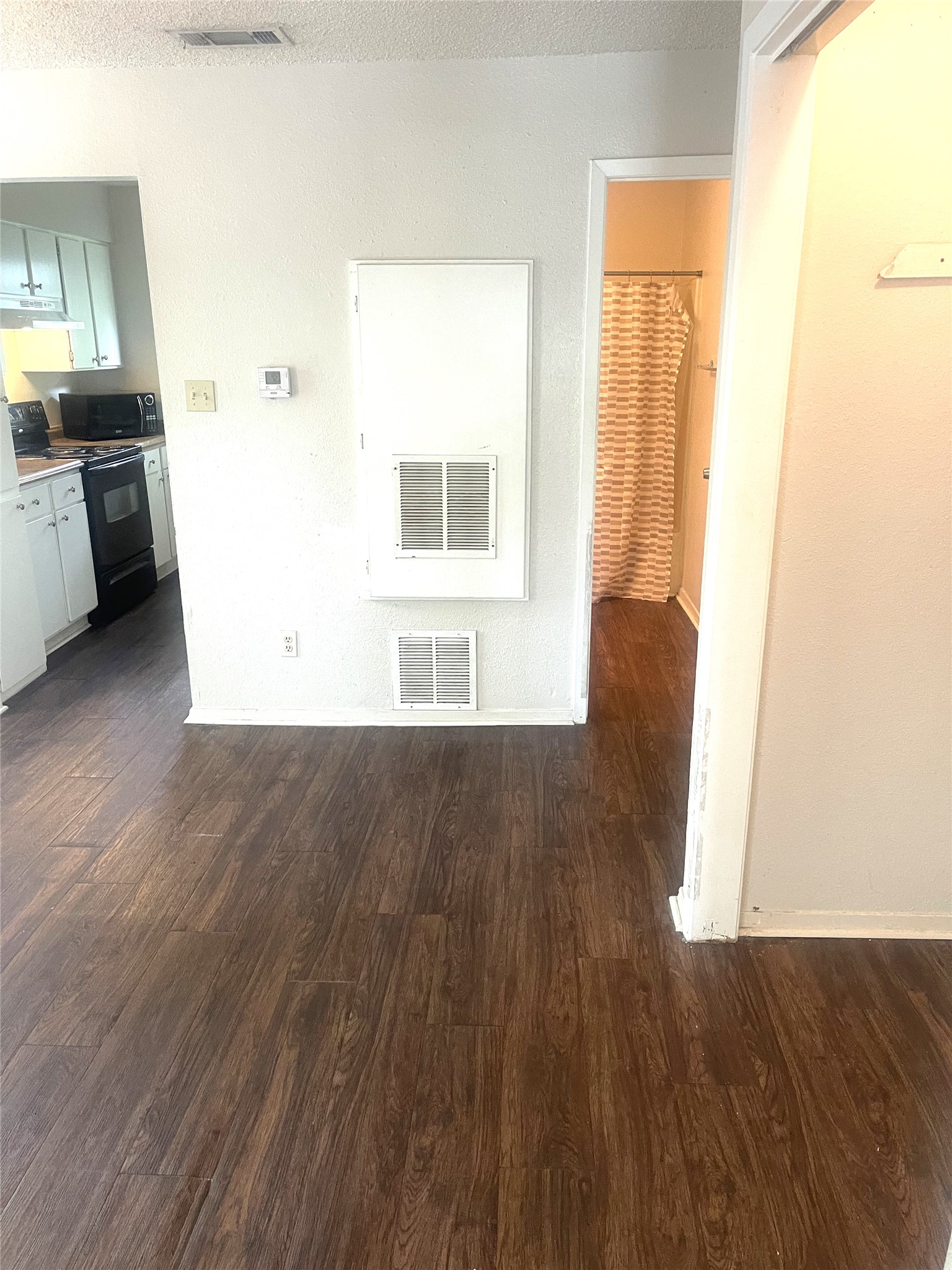 2005 West Loop, Unit D1 Austin, TX 78758 - Photo 3 of 31 a view of a kitchen with a sink wooden floor and a window