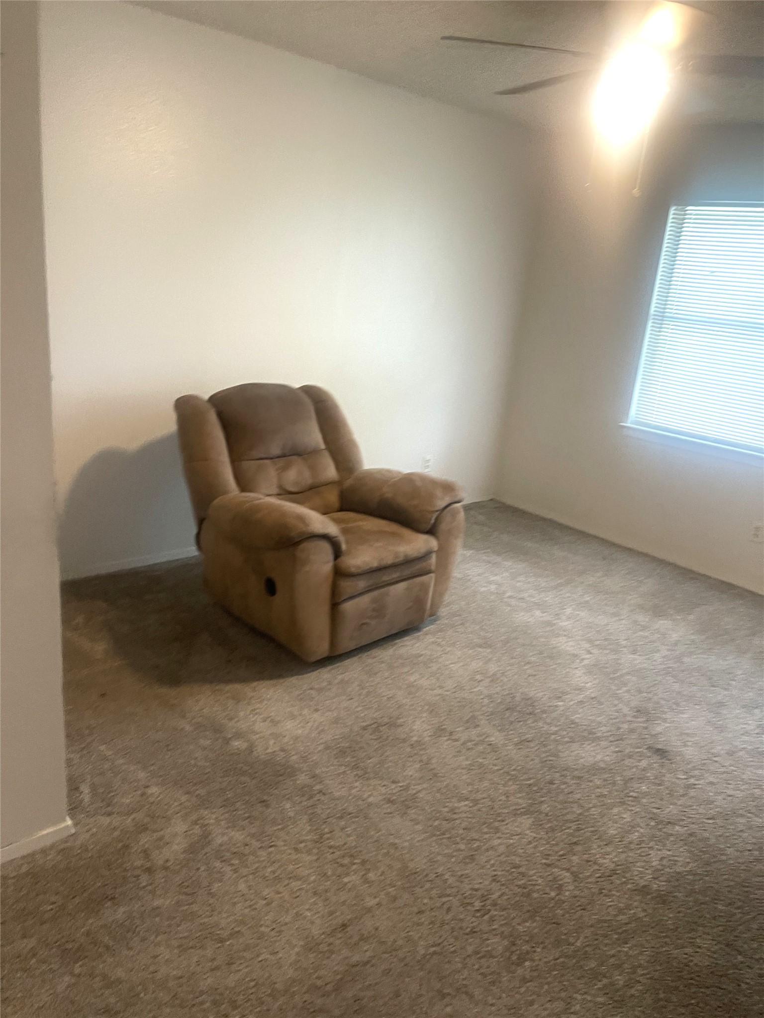 2005 West Loop, Unit D1 Austin, TX 78758 - Photo 9 of 31 a living room with furniture and a window