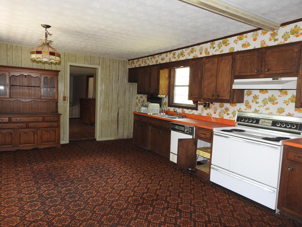 333 Lickskillet Road Epworth, GA 30541 - Photo 15 of 32 a kitchen with a stove and a refrigerator