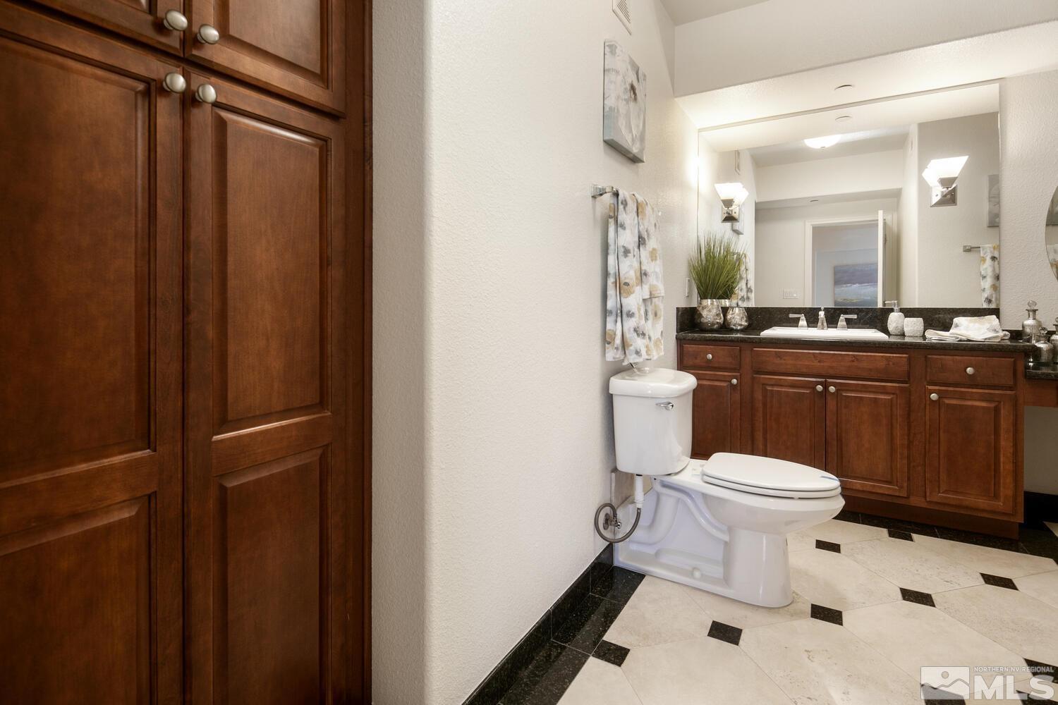 200 West 2nd Street, Unit 1507 Reno, NV 89501 - Photo 16 of 35 a bathroom with a sink a toilet and shower
