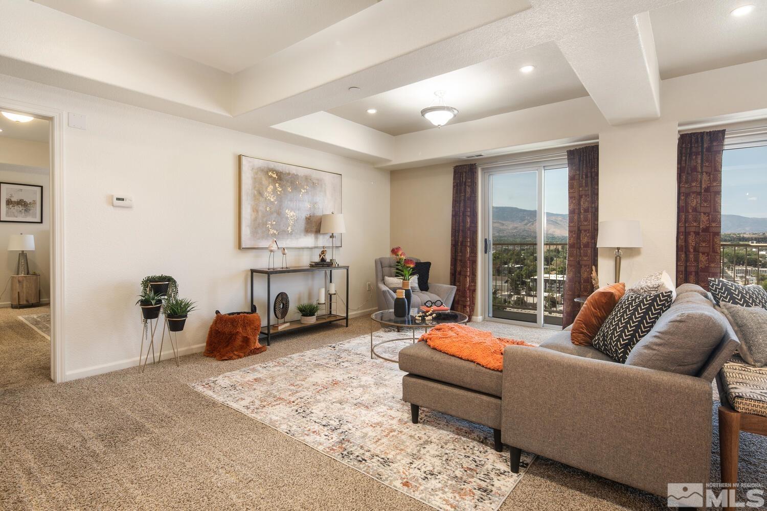 200 West 2nd Street, Unit 1507 Reno, NV 89501 - Photo 5 of 35 a living room with furniture and a large window
