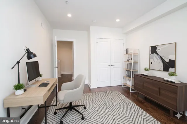 wooden floor in a hall with an empty room