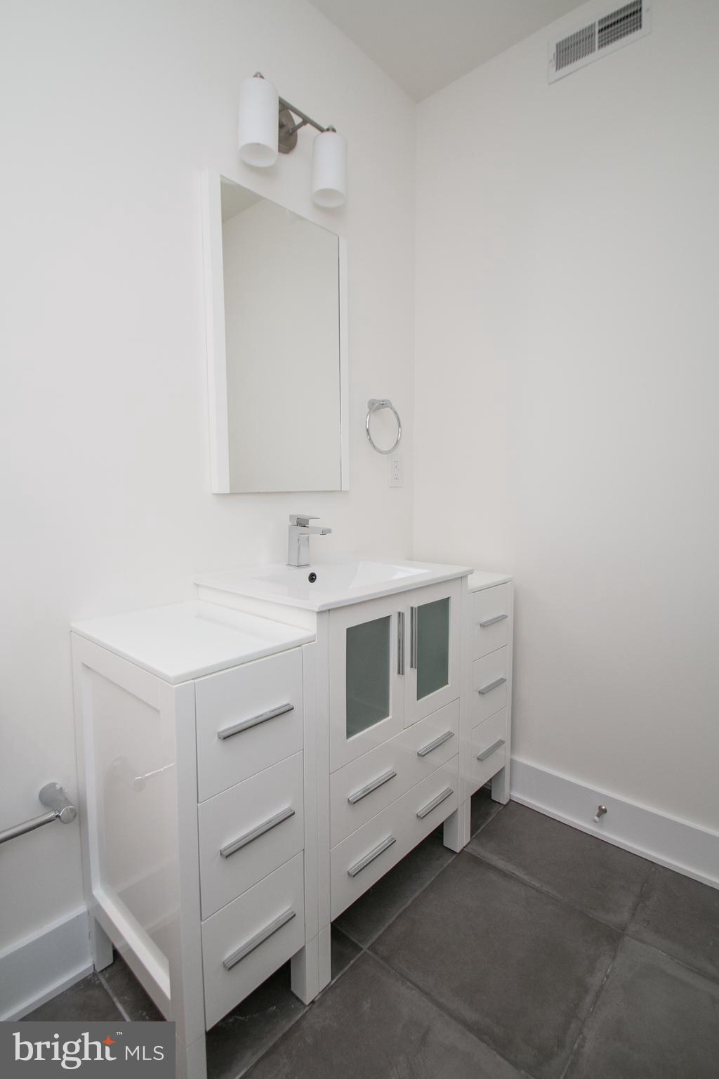1022 South 2nd Street, Unit 4 Philadelphia, PA 19147 - Photo 22 of 50 a bathroom with a sink and a mirror