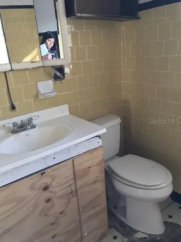 a bathroom with a toilet and a sink