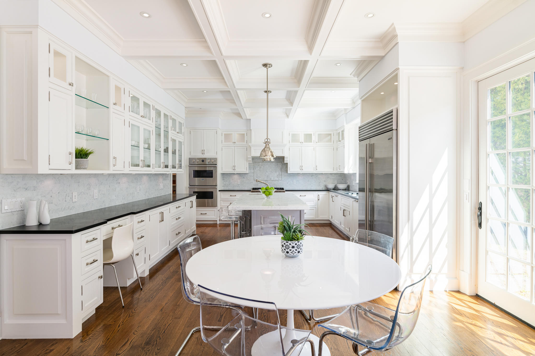 5 Gilliam Lane Riverside, CT 06878 - Photo 11 of 46 a kitchen with stainless steel appliances kitchen island granite countertop a sink a table and chairs