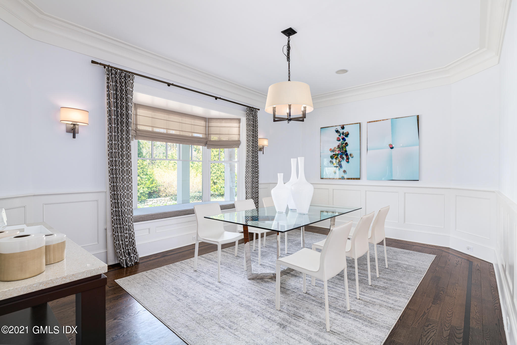 5 Gilliam Lane Riverside, CT 06878 - Photo 13 of 46 a dining room with wooden floor a chandelier a wooden table and chairs
