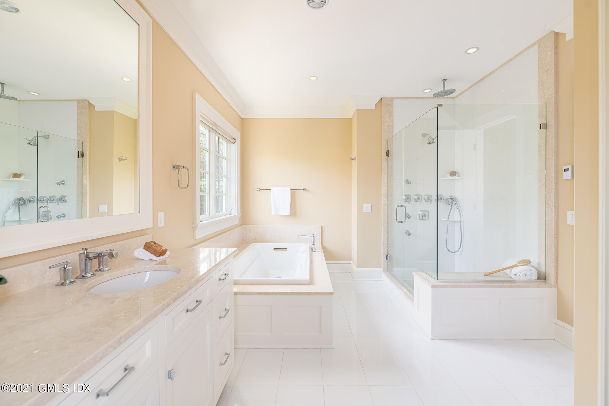 5 Gilliam Lane Riverside, CT 06878 - Photo 19 of 46 a bathroom with a tub sink shower and mirror