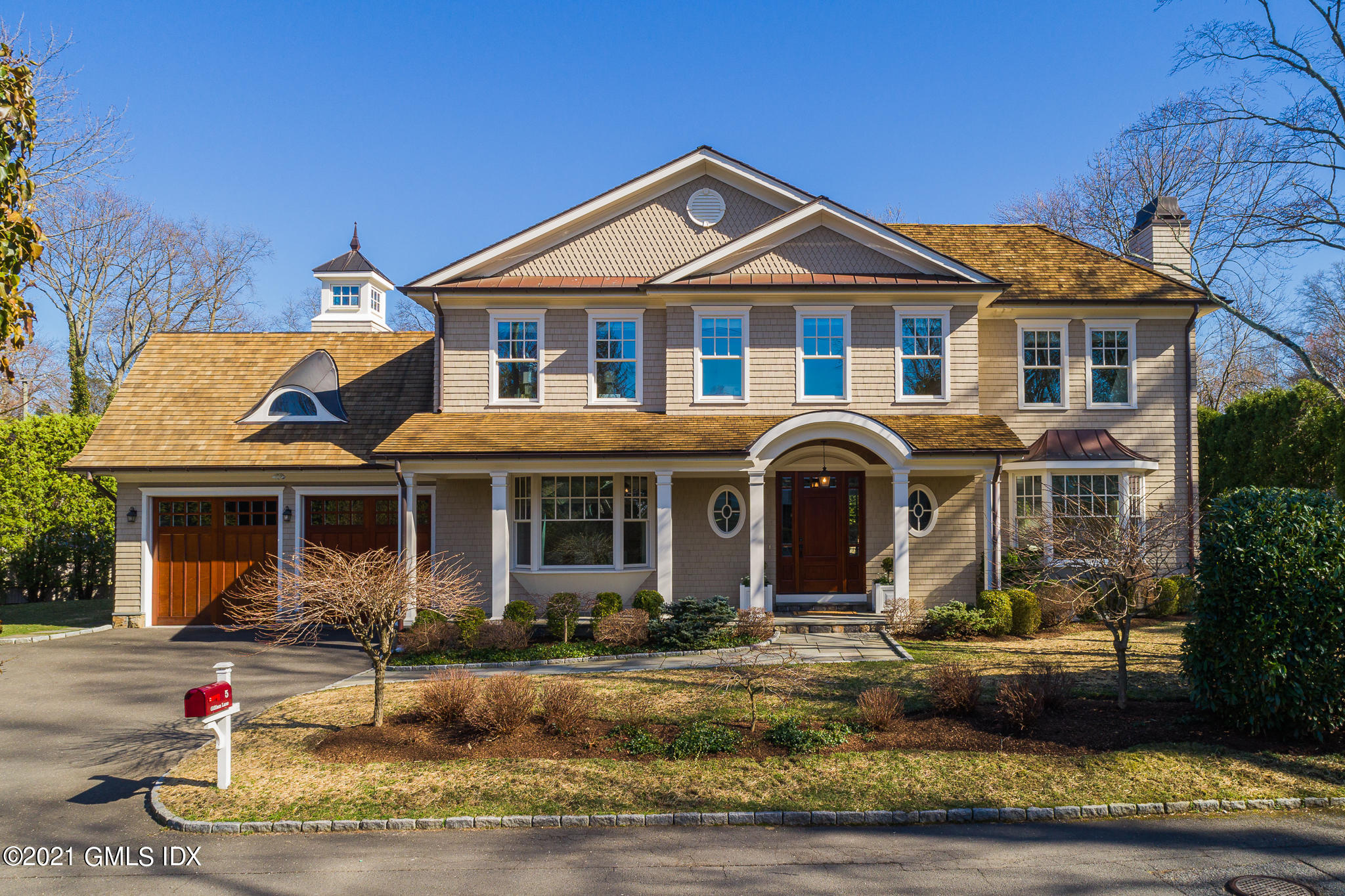 5 Gilliam Lane Riverside, CT 06878 - Photo 2 of 46 a front view of a house with a yard