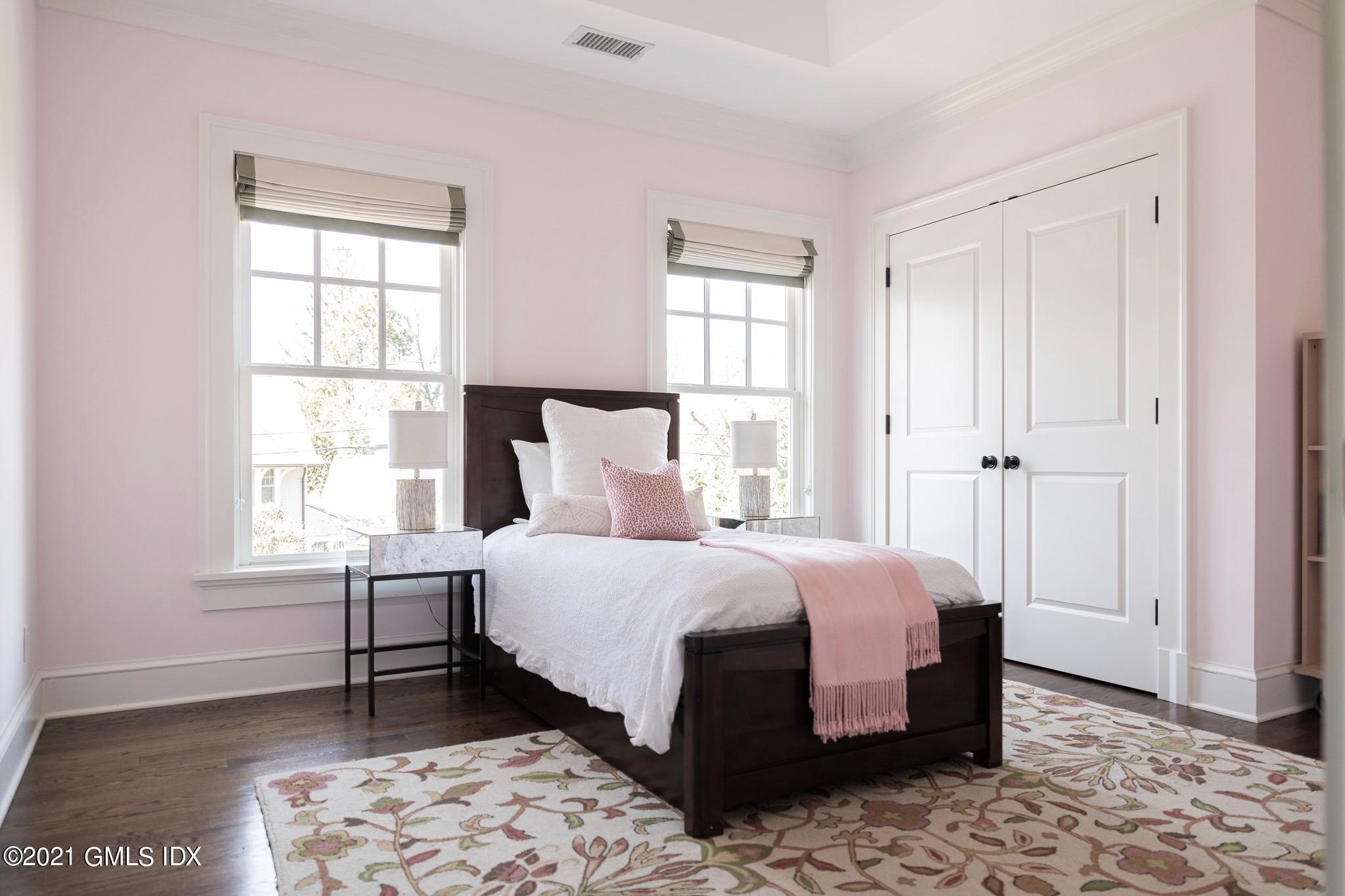 5 Gilliam Lane Riverside, CT 06878 - Photo 21 of 46 a bedroom with a bed and a window