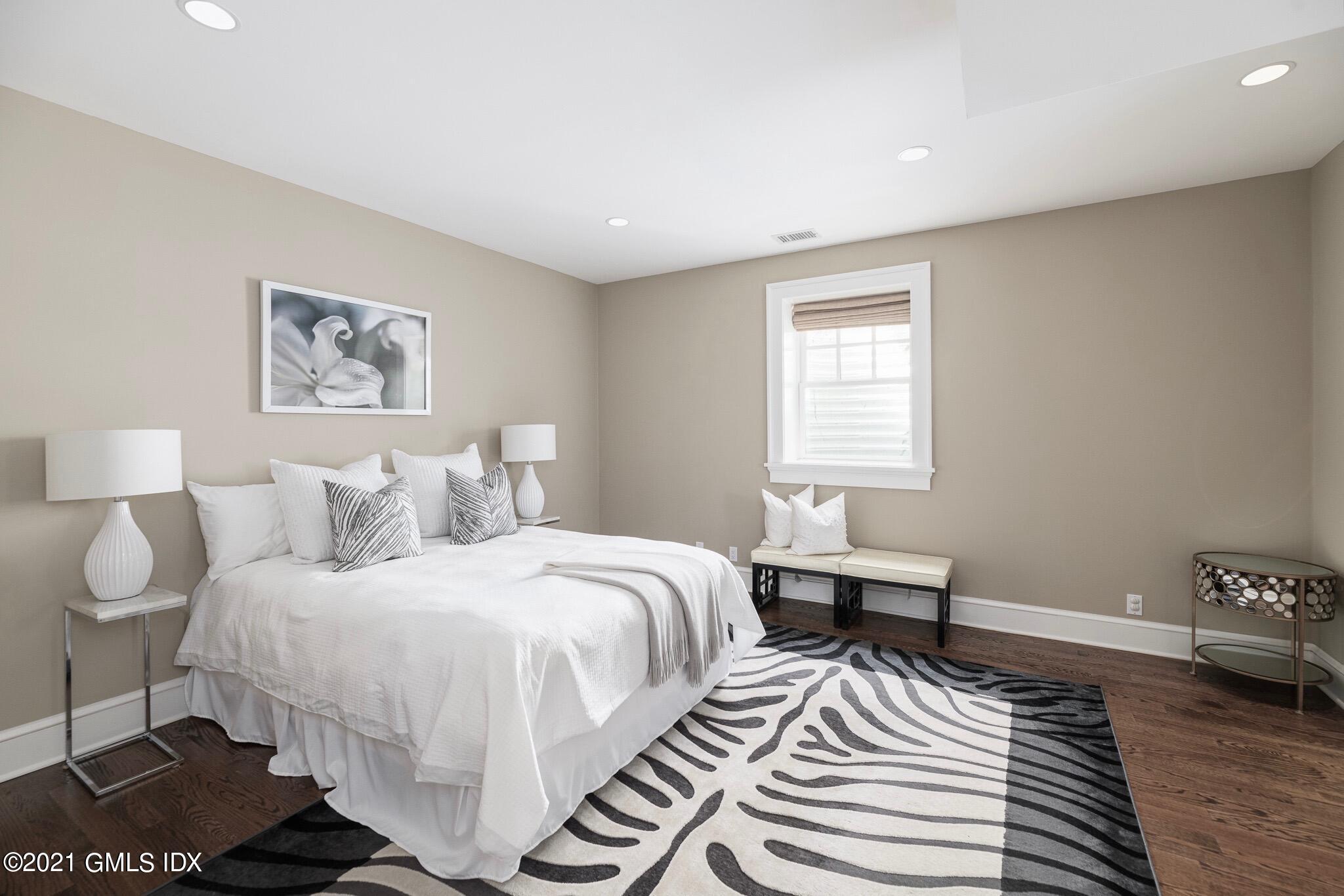 5 Gilliam Lane Riverside, CT 06878 - Photo 28 of 46 a bedroom with a bed and a window