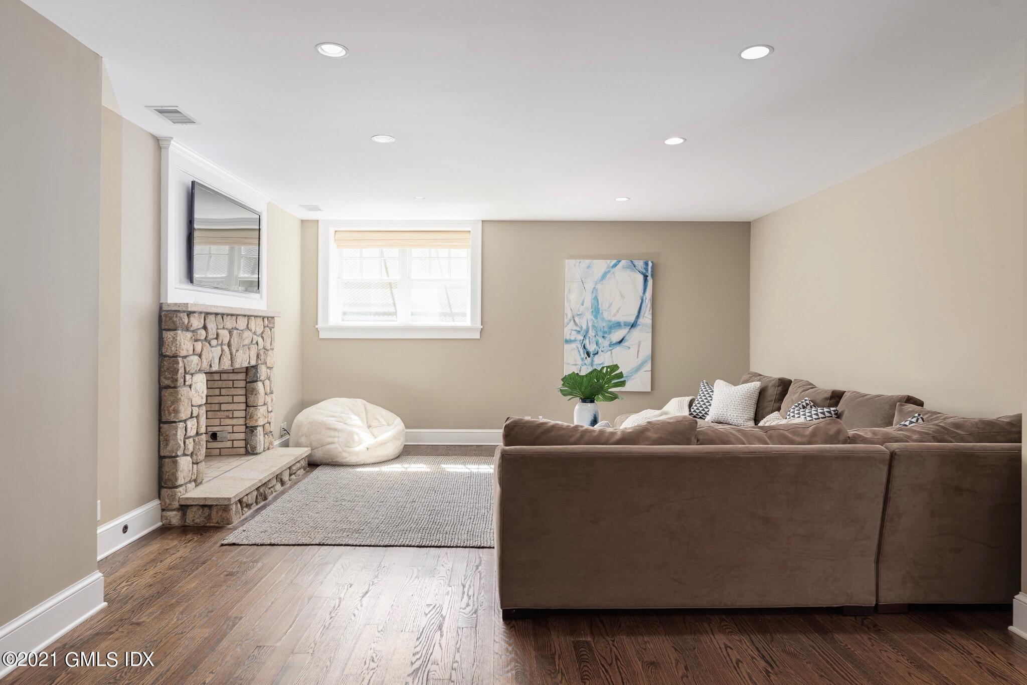 5 Gilliam Lane Riverside, CT 06878 - Photo 30 of 46 a living room with furniture and a window