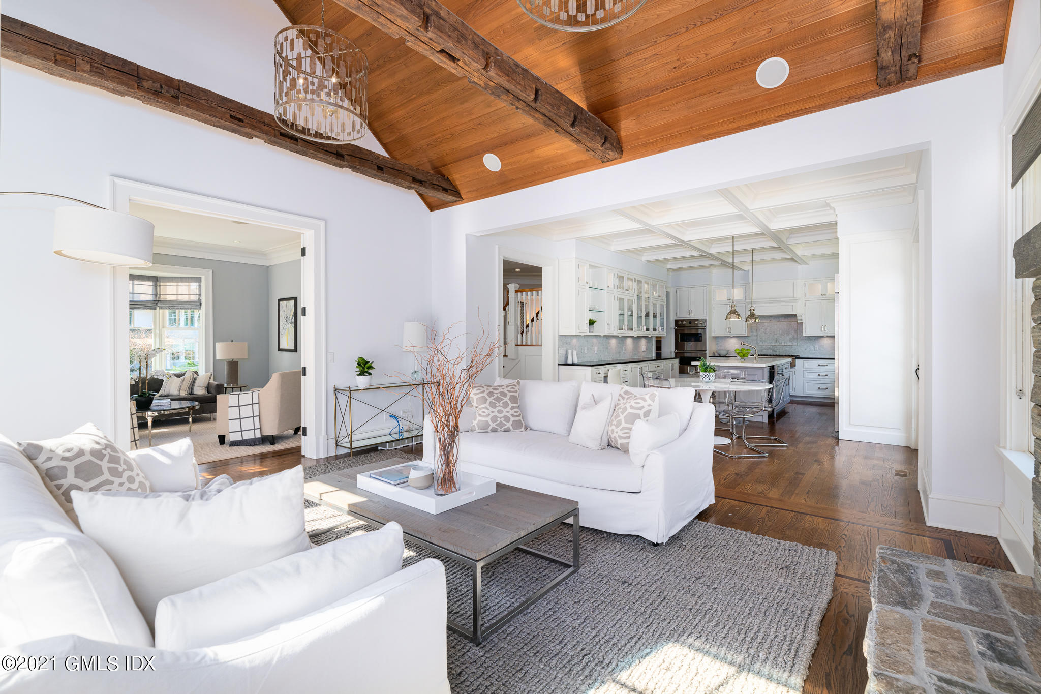 5 Gilliam Lane Riverside, CT 06878 - Photo 10 of 46 a living room with couches and a dining table with kitchen view