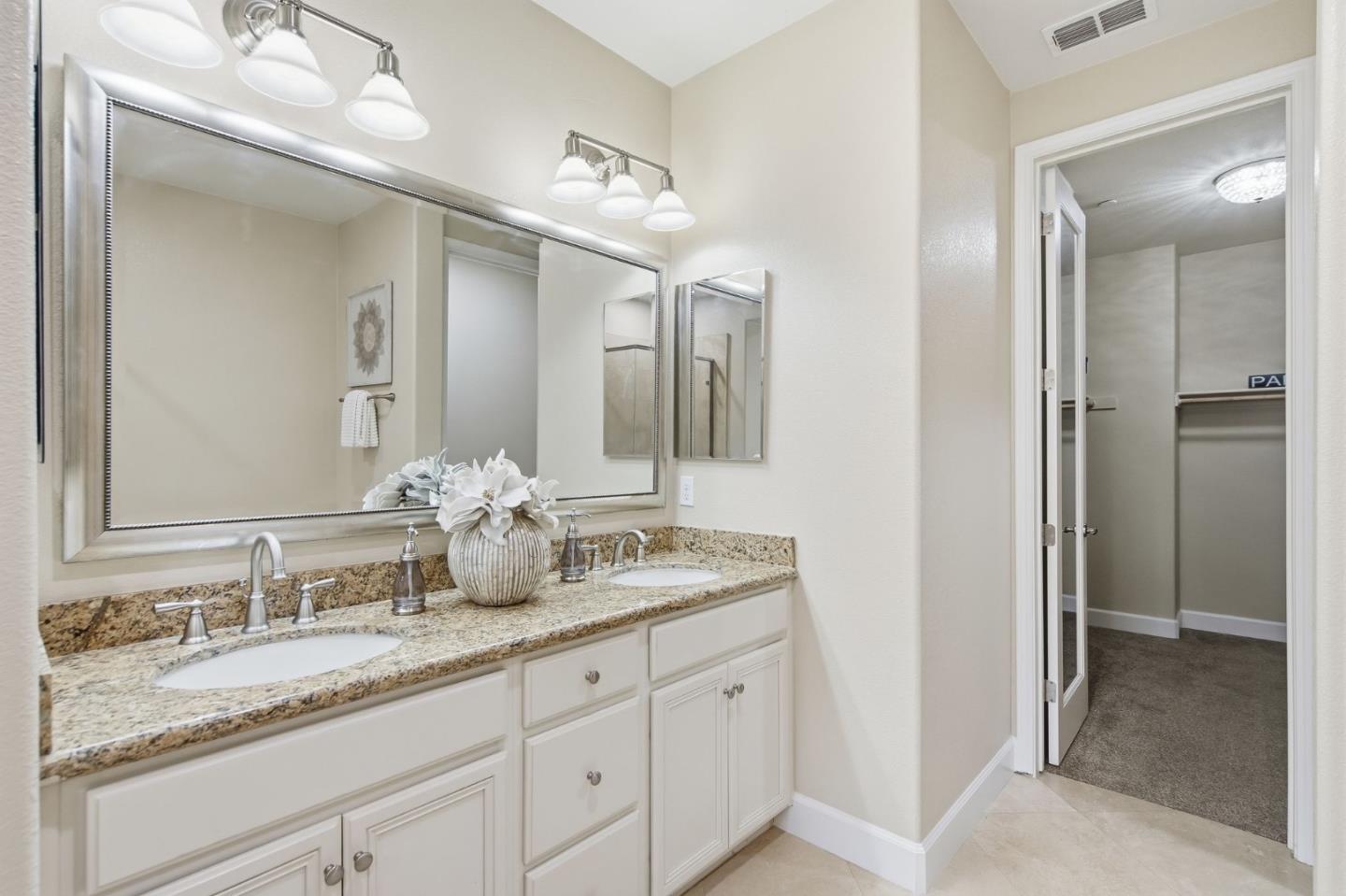 478 Rialto Place San Jose, CA 95128 - Photo 13 of 26 a bathroom with double sink and a mirror