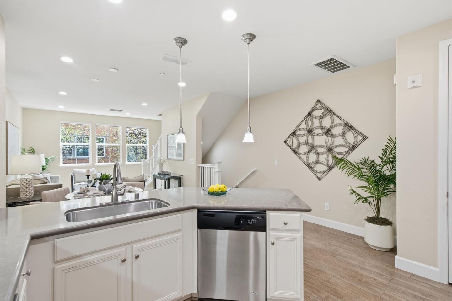 478 Rialto Place San Jose, CA 95128 - Photo 3 of 26 a kitchen with a sink a counter appliances and wooden floor
