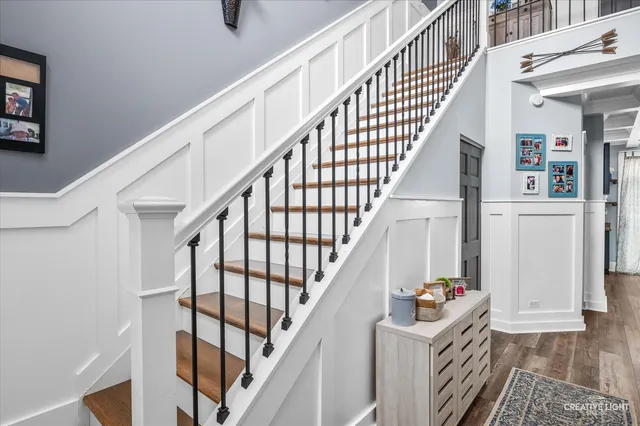 a kitchen with a sink and a mirror