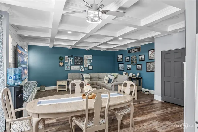 a view of hallway with furniture and wooden floor