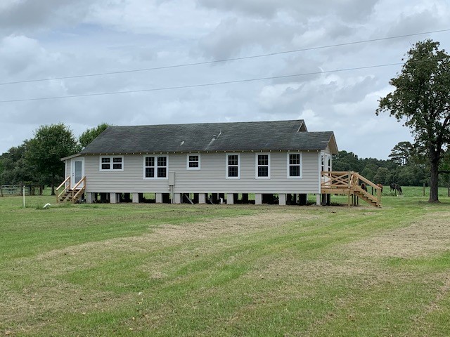29231 Sheffield Road Waller, TX 77484 - Photo 16 of 18 a house view with a garden space