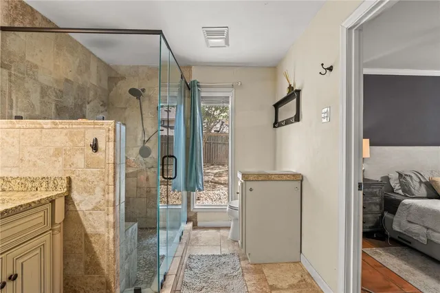 a bathroom with a tub and shower
