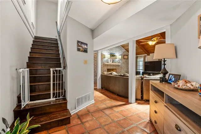 a kitchen with sink and refrigerator
